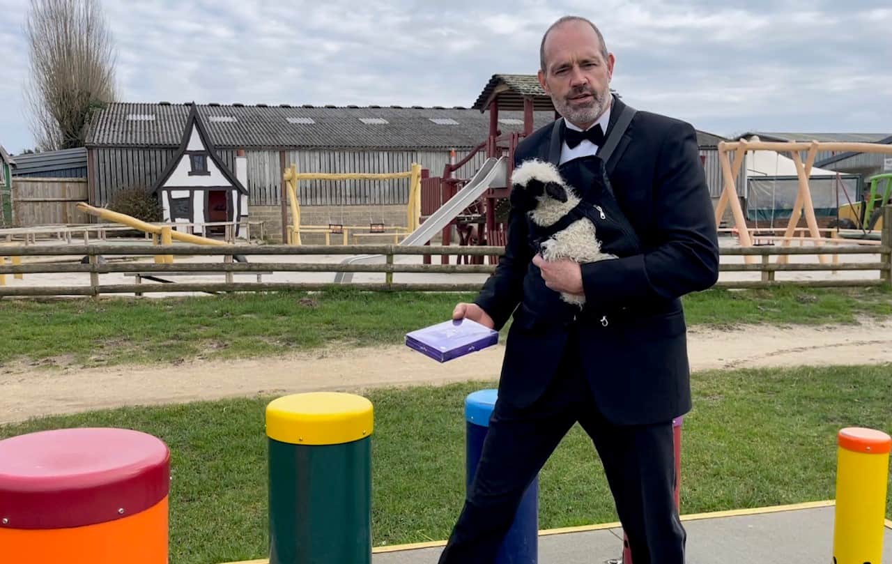 Farmer-Palmer-and-lamb-delivering-message-and-box-of-chocolates